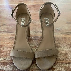 Tan high heeled shoes
